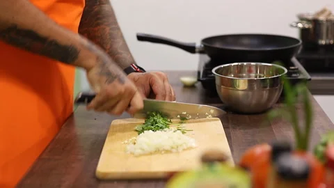 The chef is preparing a dish. Close-up hands. Video stock 169034066
