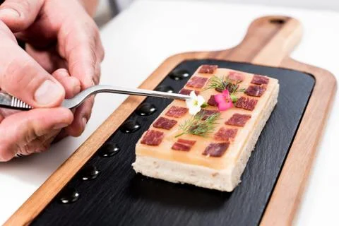 Chef preparing a dish with Iberian ham Stock Photos
