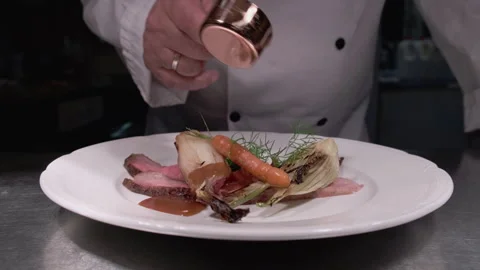 Chef Preparing a Dish of Iberico Steak Stock Footage 245970277