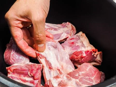 Chef preparing a dish with lamb Stock Photos