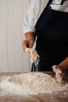 Chef preparing dough - cooking process, work with flour Stock Photos