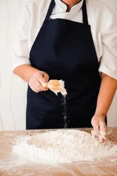 Chef preparing dough - cooking process, work with flour. Stock Photos