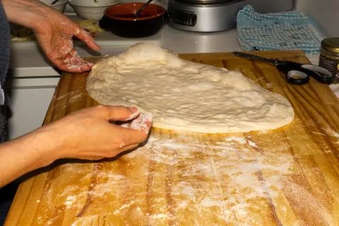 Chef preparing the dough for home made pizza Stock Photos