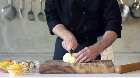 Chef preparing dough in a kitchen Stock Footage 66583694