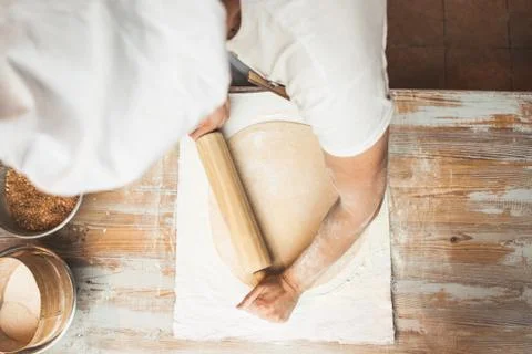 Chef preparing dough in a kitchen. Stock Photos