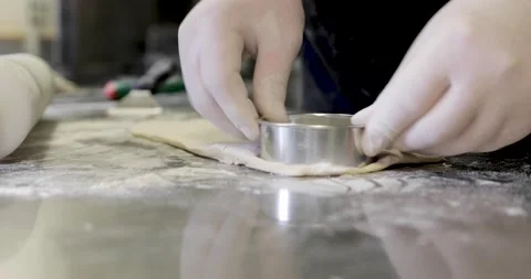 Chef preparing dough with mold for pastry closeup Video stock 136406200