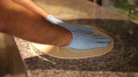 Chef is preparing dough for pizza. Stock Footage 133772322