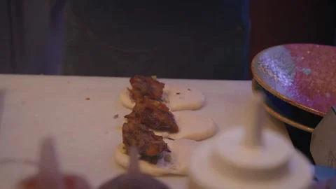 Chef preparing duck bao bun with eel sauce 4K close up video Stock Footage 315990505