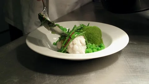 Chef Preparing Fish Course at the Pass Stock Footage 245969529