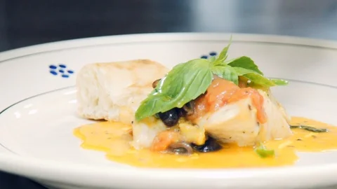 The chef is preparing a fish dish. Stock Footage 113861498