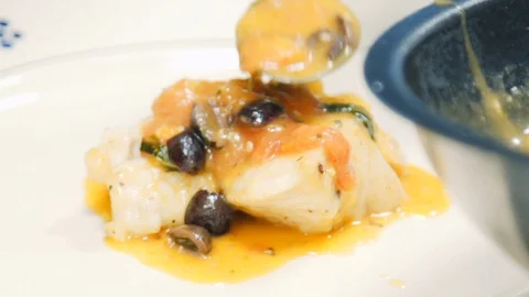 The chef is preparing a fish dish. Stock Footage 113861524