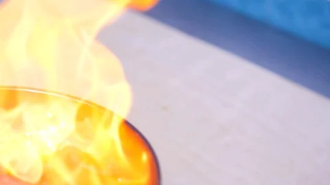 Chef preparing Flambe style dish on a pan. close-up Stock Footage 126761072