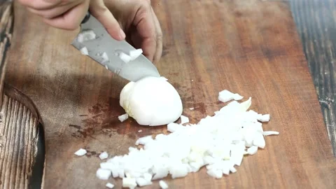 Chef Preparing Food in Home. Close-up Cook Man Hands Cut White Onion Stock Footage 150691667