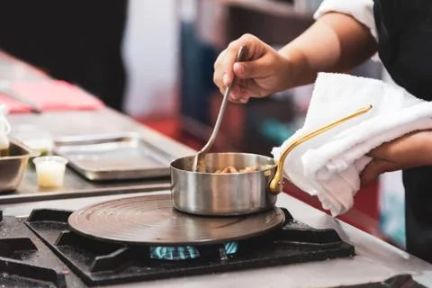 Chef preparing food in the kitchen, chef cooking Stock Photos
