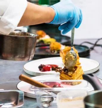 Chef preparing food in the kitchen, chef cooking Stock Photos