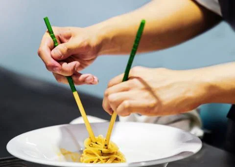 Chef preparing food in the kitchen, chef cooking, Chef decorating dish Stock Photos