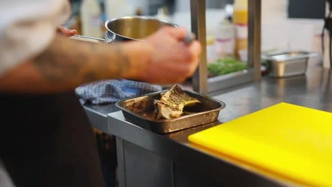 A chef is preparing food in a kitchen Stock Footage 301517376
