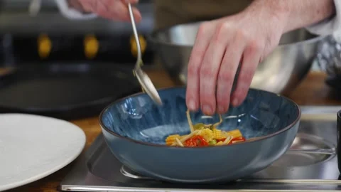 A chef is preparing food in a kitchen Stock Footage 301630162