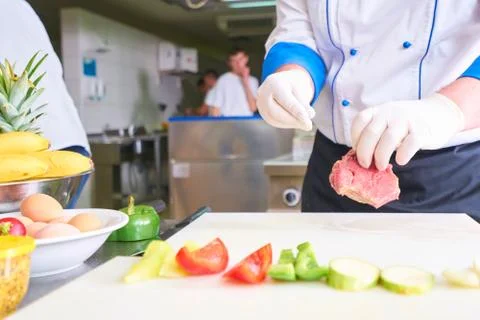 Chef preparing food Stock Photos