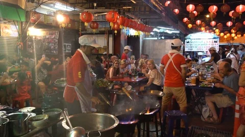 Chef preparing food with stir fry on street. Stock Footage 88291953