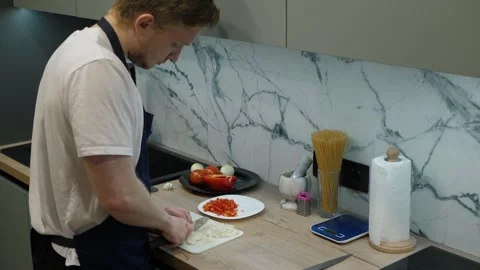 Chef Preparing Fresh Ingredients in Modern Kitchen Stock Footage 308487682