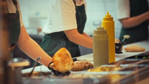 Chef preparing fresh pita bread in busy street food kitchen Stock Footage 331348369