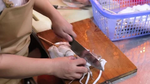 Chef Preparing Fresh Squid Skewers on Wooden Cutting Board Vídeos de archivo 344217747