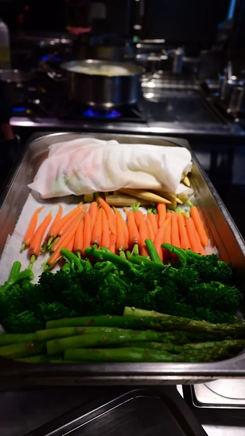 Chef preparing fresh vegetables and cheese in a professional kitchen Stock-Footage 327255203