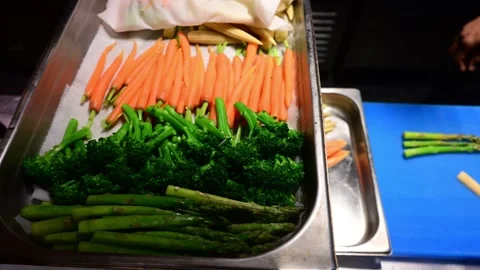 Chef preparing fresh vegetables and cheese in a professional kitchen Stock-Footage 327255242
