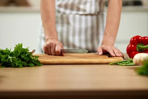 Chef preparing fresh vegetables for healthy cooking 写真素材