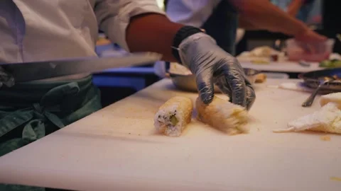 Chef preparing fried tempura sushi rolls and slicing – 4K close up Stock Footage 315509430