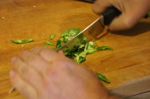 Chef preparing green peppers  .. Stock Photos