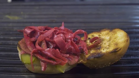 Chef preparing hamburger or sandwich in fast food restaurant Stock Footage 80597258