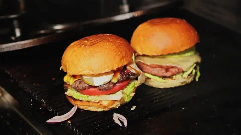 Chef preparing hamburger in restaurant kitchen Stock Footage 208380934
