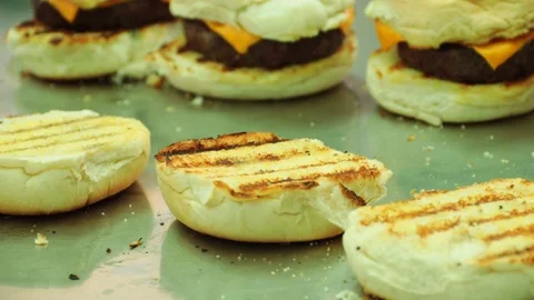 Chef preparing hamburgers on a professional kitchen Stock Footage 127716050