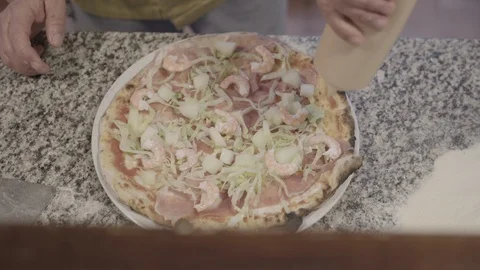 Chef Preparing a Homemade Pizza In The Kitchen Stock Footage 87551315