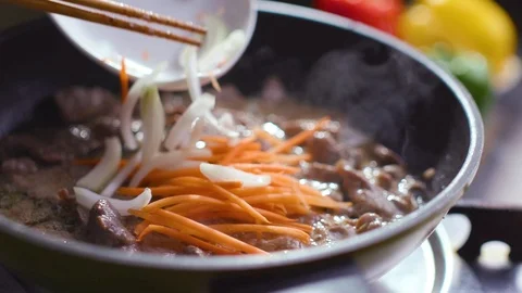 Chef is preparing a Korean dish Pulcogi, meat in Korean. Stock Footage 121744860