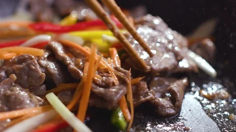Chef is preparing a Korean dish Pulcogi, meat in Korean. Stock Footage 121744952