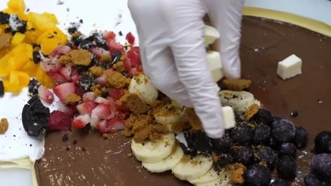Chef Preparing a Loaded Dessert Crepe with Chocolate Spread, Fruit, and Cheese C Stock Footage 345653798