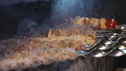 The chef is preparing a meat kebab. Stock Footage 131208273