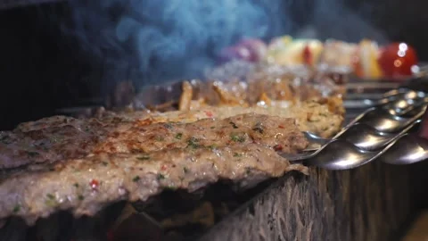 The chef is preparing a meat kebab. Stock Footage 132310951