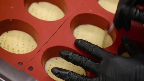 Chef Preparing Mini Dessert Pies in Red Silicone Mold – Professional Pastry Prep Stock Footage 337751604