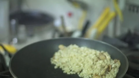 Chef preparing mushroom rice in kitchen Stock Footage 98240884