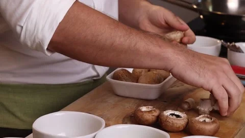 Chef preparing mushrooms on table Stock Footage 153772000
