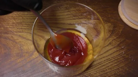 Chef preparing mustard and tomato paste sauce Stock Footage 306896321