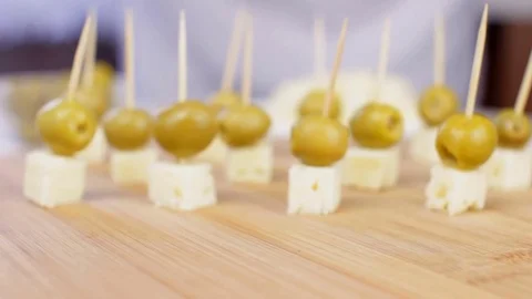 Chef Preparing Olive and Cheese Snacks for Party Stock Footage 83710661