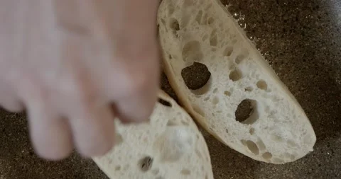 A chef is preparing a pan fried toasts at cooking class, close up, 4k. Making a Stock Footage 221043702