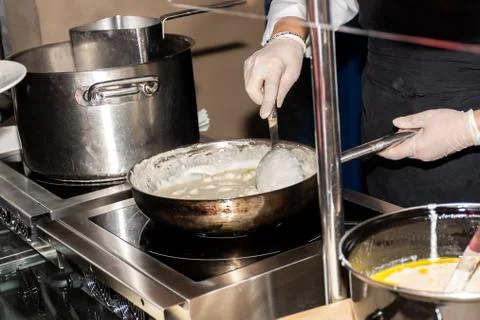 Chef preparing pasta during brunch buffet or food bloggers Stock Photos