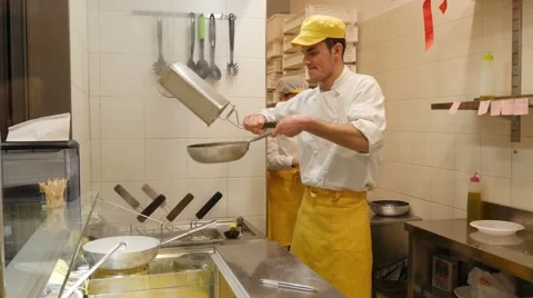 Chef preparing pasta in a kitchen Stock Footage 60850020
