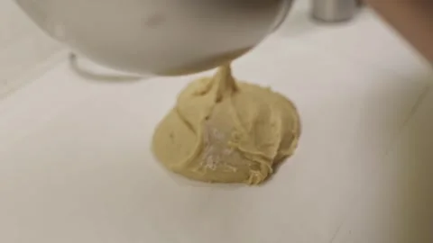 Chef preparing pastry dough on parchment paper Stock Footage 320109966
